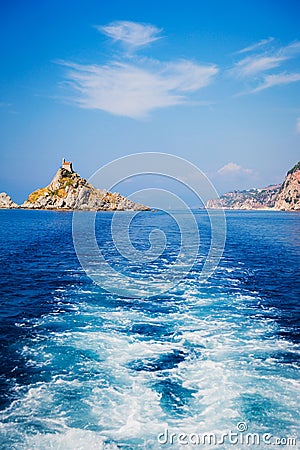Wave trace tails of speed boat on blue water surface in the sea Stock Photo