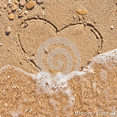 Wave washes away the heart Stock Photo