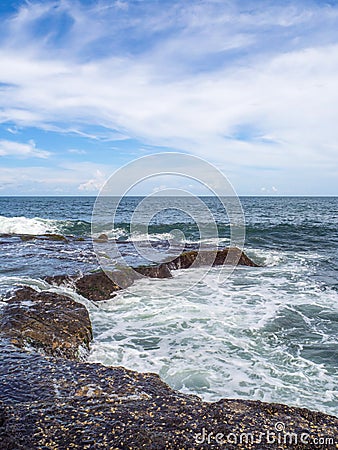 Waves beat on the stones with splashes. Stock Photo