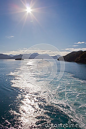 Waves behind ship crossing Cook Inlet from North island of New Zealand to South Island Stock Photo