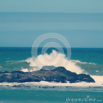 Waves breaking on the rocks cape town Stock Photo