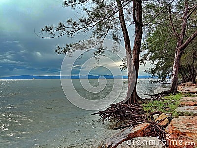 waves can erode the sand on the beach Stock Photo