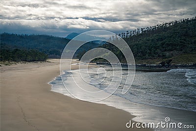 The waves cover a beach as the tide rises Stock Photo