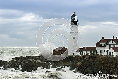 Waves Crash Next to Oldest Lighthouse in Maine Stock Photo