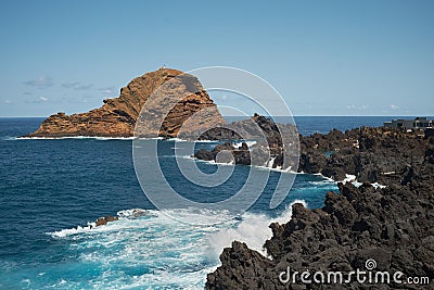 waves crashing on coastline volcanic rocks, ilheu mole Porto Moniz Stock Photo