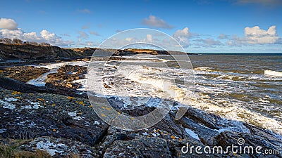 Waves Crashing on Howick`s Rocky Shore Stock Photo