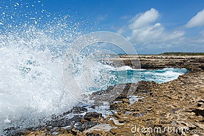 Waves Crashing over Devil's Bridge Coastline Antigua Stock Photo