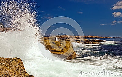 Waves crashing on rocks Stock Photo