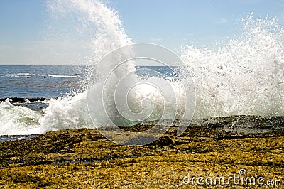 Waves crashing on rocks Stock Photo