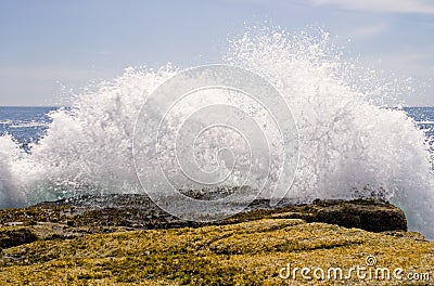 Waves crashing on rocks Stock Photo