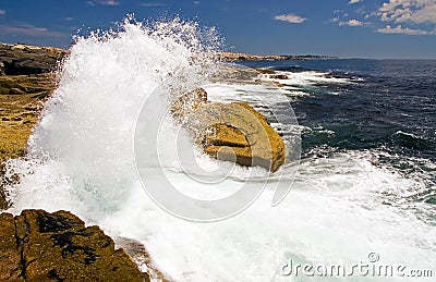 Waves crashing on rocks Stock Photo