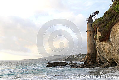 Waves crashing on the rocks at the base of La Tour the Tower in Laguna Beach, Ca Stock Photo