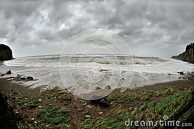 Danger waves on the stormy shore Stock Photo