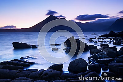 Waves crashing on shoreline with moody dramatic sky at Elgol on the Isle of Skye, Scotland, UK. Stock Photo