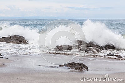 Waves crashing to rocks montezuma beach Stock Photo