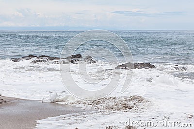 Waves crashing to rocks montezuma beach Stock Photo