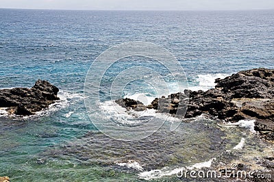Waves fill ocean cove Stock Photo