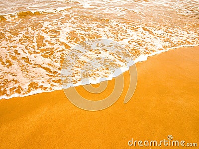 Waves on the gilded sand Stock Photo