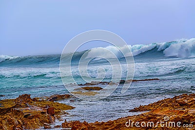 Big waves hitting the beach Stock Photo