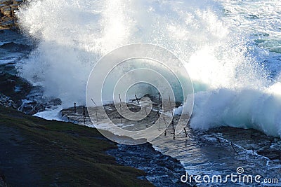 Waves hitting the bogey hole Stock Photo