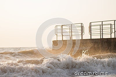 Waves near the pier Stock Photo