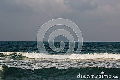 The waves near the shore foam, wave crests Stock Photo