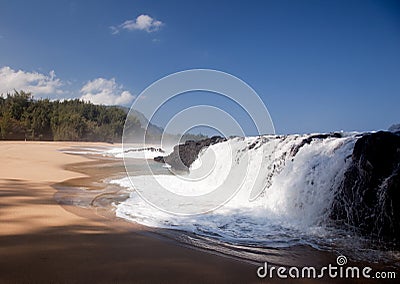 Waves over rocks on Lumahai Stock Photo