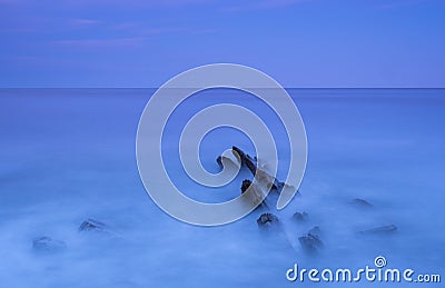 The waves of the sea hit rocks on the Euskadi Stock Photo