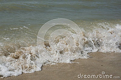 Waves on the shore of the Sea of Azov beach. Waves run to the seashore. Stock Photo