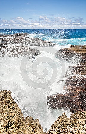 Waves smashing on rocky coastline Stock Photo