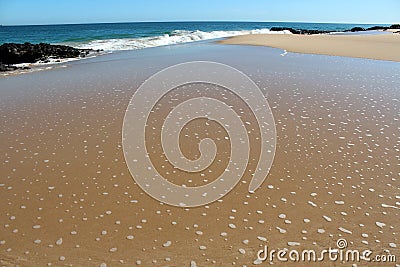 Waves splashing on basalt rocks at Ocean beach Bunbury Western Australia Stock Photo