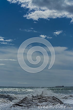 Waves splashing on the groyne Stock Photo