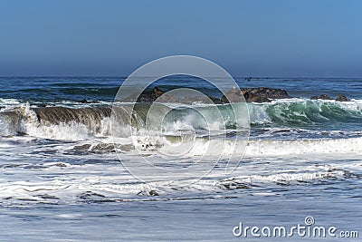 Waves splashing on huge rocks, off shore, Stock Photo