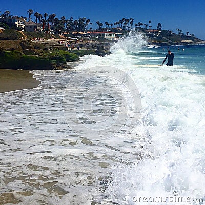 Waves Splashing onto large Rocks Editorial Stock Photo