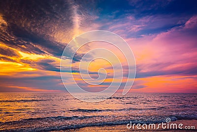 Waves and sunset on beach Stock Photo