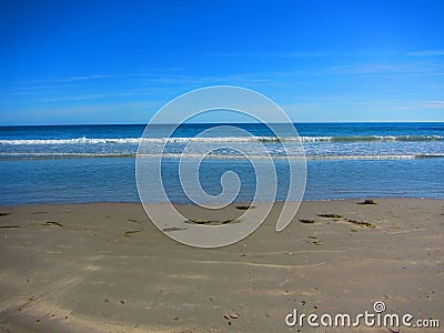 Waves washing onshore at a beach Stock Photo