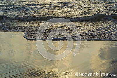 Waves washing sand Stock Photo