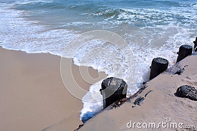 Waves Washing to Shore Along Bulkhead Stock Photo