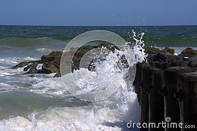 Waves Washing to Shore Along Bulkhead Stock Photo
