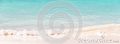 Waves on white sand and turquoise water, panoramic background Stock Photo