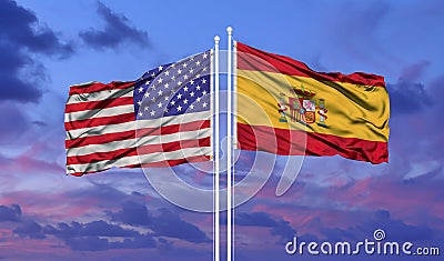 Waving American flag and flag of Spain. Closeup view Stock Photo