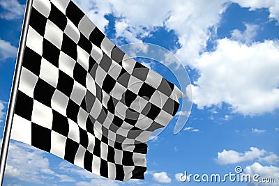 Waving checkered flag in front of a cloudy sky Stock Photo