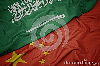 waving colorful flag of china and national flag of saudi arabia Stock Photo