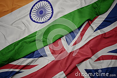 waving colorful flag of great britain and national flag of india Stock Photo