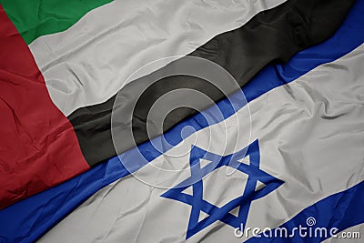 waving colorful flag of israel and national flag of united arab emirates Stock Photo