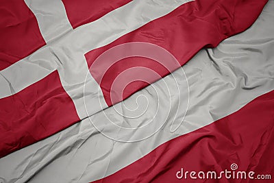 waving colorful flag of poland and national flag of denmark Stock Photo