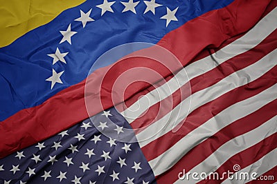 waving colorful flag of united states of america and national flag of venezuela Stock Photo