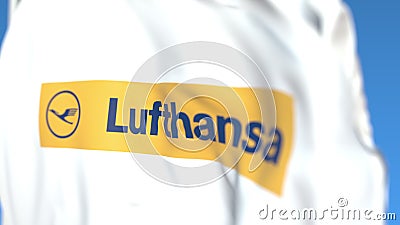Flying flag with Lufthansa logo, close-up. Editorial 3D rendering Editorial Stock Photo