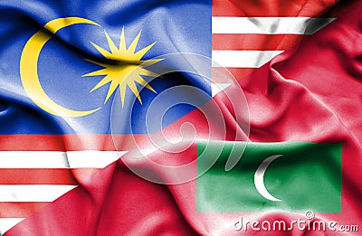 Waving flag of Maldives and Malaysia Stock Photo