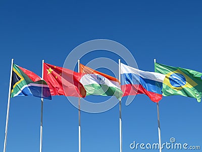 Waving flags of the BRICS countries against the blue sky Stock Photo